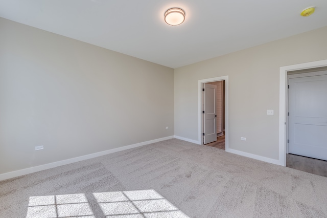 unfurnished bedroom with light carpet