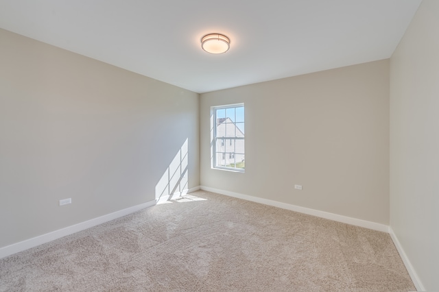 empty room featuring light carpet