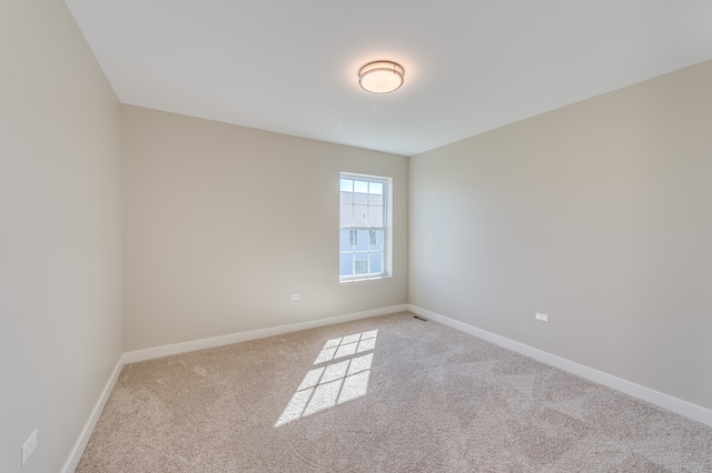 spare room with light carpet