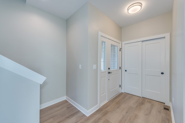 foyer entrance with light hardwood / wood-style flooring