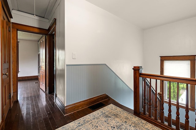 26811 S Kankakee St, Manhattan, IL 60442 - corridor featuring an upstairs landing, attic access, dark wood-type flooring, and wainscoting