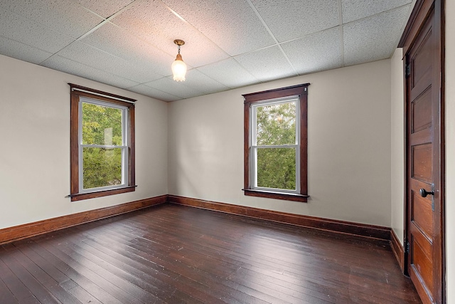 26811 S Kankakee St, Manhattan, IL 60442 - unfurnished room featuring dark wood-style floors, plenty of natural light, and a drop ceiling