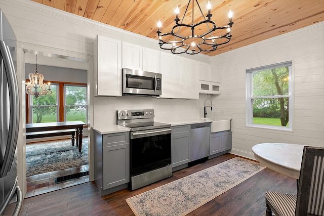 26811 S Kankakee St, Manhattan, IL 60442 - kitchen with stainless steel appliances, a chandelier, gray cabinets, wooden ceiling, and crown molding