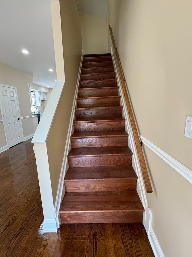 stairs with wood-type flooring