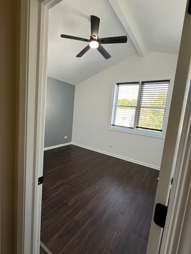 unfurnished room with lofted ceiling with beams, ceiling fan, and dark hardwood / wood-style flooring