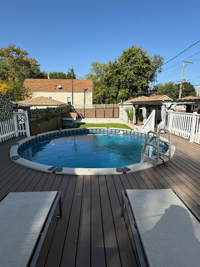 view of swimming pool featuring a deck