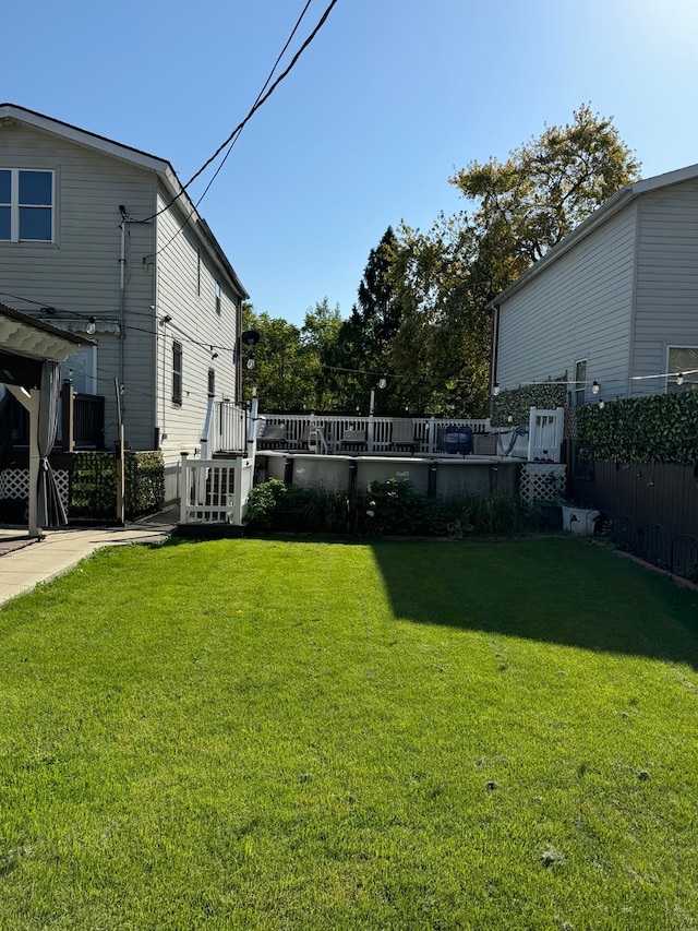 view of yard with a wooden deck