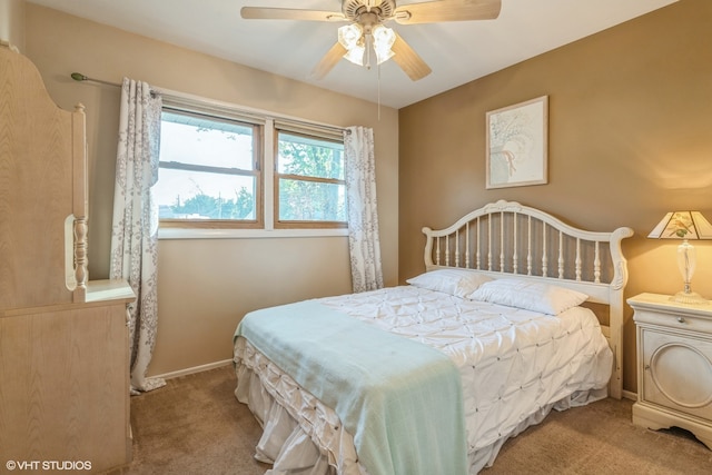 bedroom with light colored carpet and ceiling fan