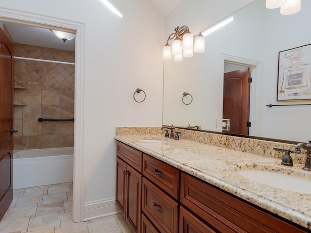 bathroom featuring vanity and tiled shower / bath combo