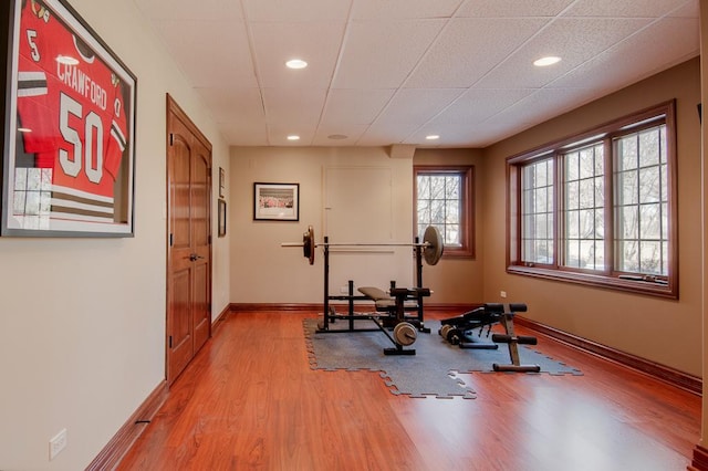 workout room featuring light wood-type flooring