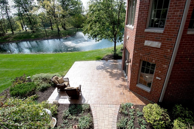 view of patio with a water view