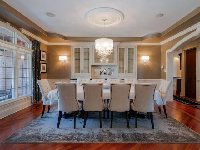 dining room featuring dark wood-type flooring and an inviting chandelier