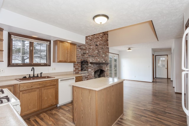 kitchen with a center island, sink, dark hardwood / wood-style flooring, white dishwasher, and range