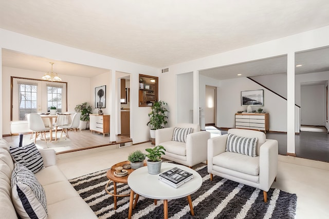 living room featuring a notable chandelier