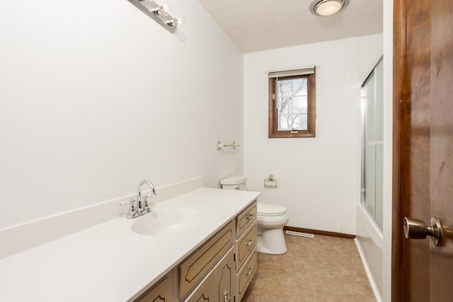 full bathroom featuring a textured ceiling, vanity, toilet, and enclosed tub / shower combo