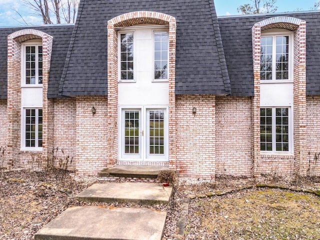 view of exterior entry featuring french doors