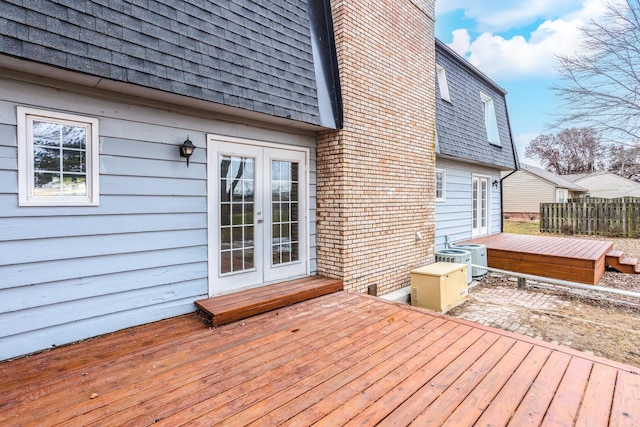 wooden deck featuring central AC and french doors