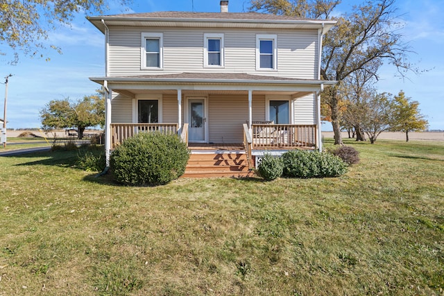 view of front of house with a front lawn and covered porch