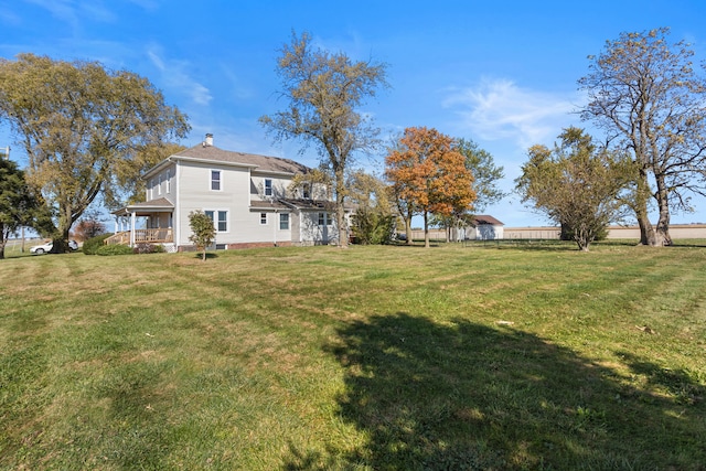 view of yard featuring covered porch