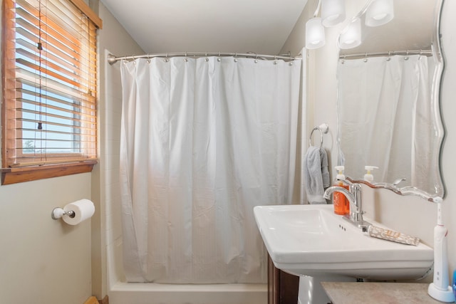 bathroom featuring vanity and curtained shower