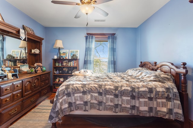 bedroom with hardwood / wood-style floors and ceiling fan