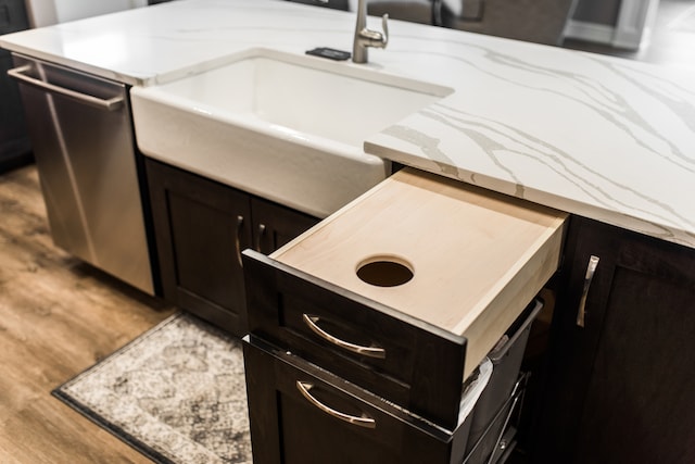 kitchen featuring hardwood / wood-style floors and light stone countertops