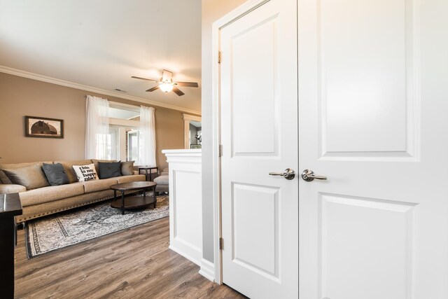 506 Stearn Dr Unit 506, Genoa, IL 60135 - living room with ornamental molding, ceiling fan, and wood finished floors
