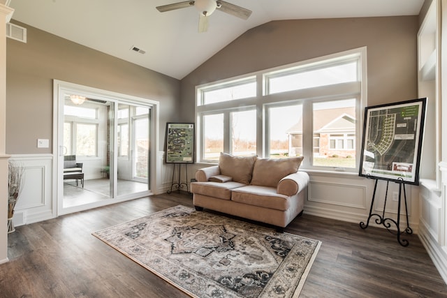 living room featuring vaulted ceiling, a wealth of natural light, dark hardwood / wood-style floors, and ceiling fan