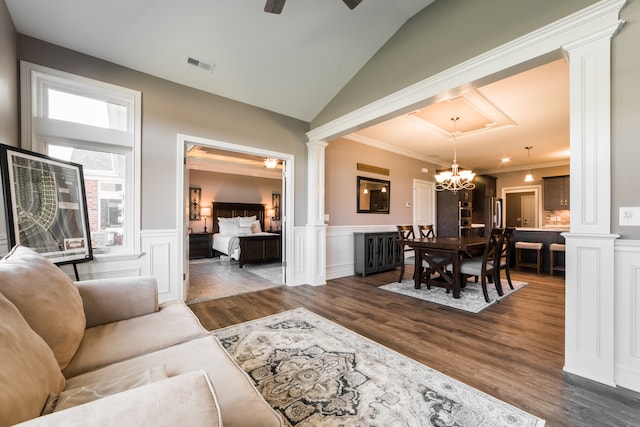 living room with ornamental molding, dark wood-type flooring, and ornate columns