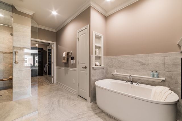 bathroom featuring ornamental molding, independent shower and bath, and tile walls