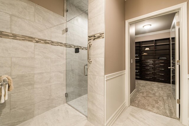 506 Stearn Dr Unit 506, Genoa, IL 60135 - bathroom with a shower stall, crown molding, and a walk in closet