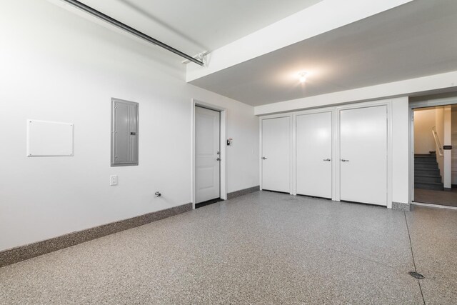 506 Stearn Dr Unit 506, Genoa, IL 60135 - garage featuring electric panel and baseboards