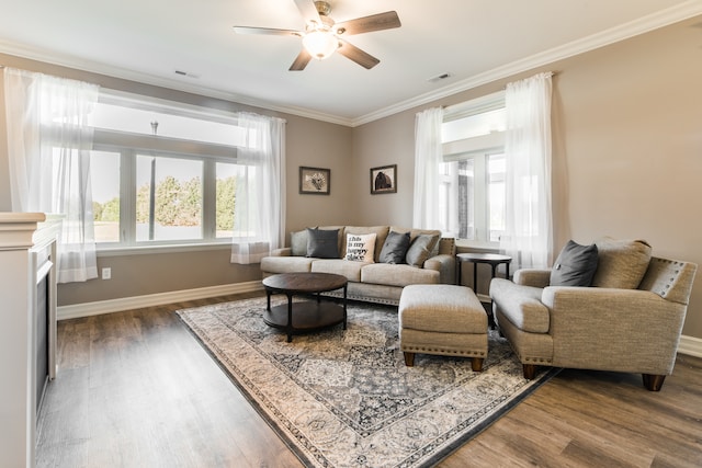 living room featuring ornamental molding, ceiling fan, and dark hardwood / wood-style flooring