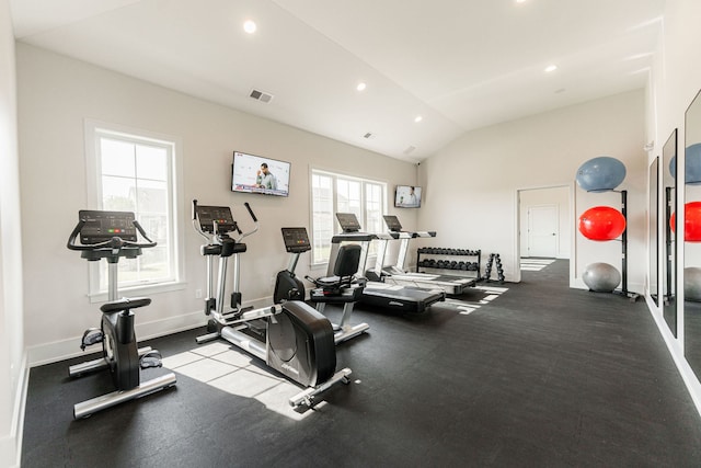 gym with vaulted ceiling