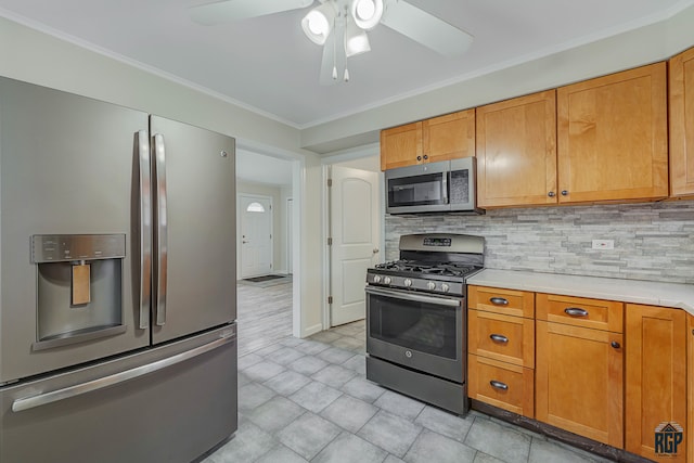 kitchen featuring ornamental molding, appliances with stainless steel finishes, ceiling fan, and tasteful backsplash