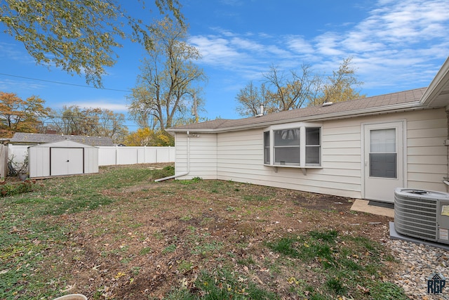 view of yard with a storage unit and central AC