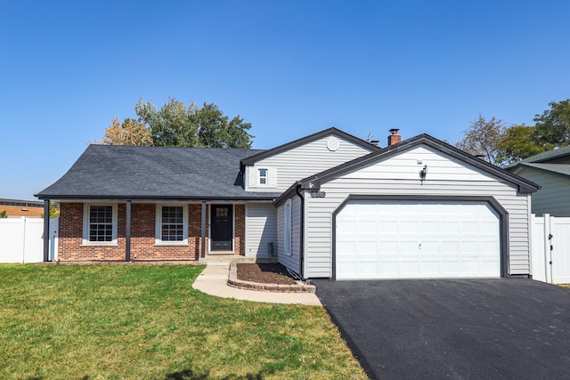 ranch-style home with a front lawn and a garage