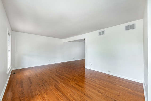 unfurnished room featuring hardwood / wood-style floors