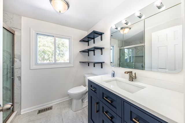 bathroom with vanity, toilet, and walk in shower