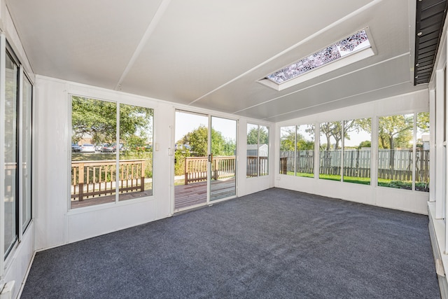 unfurnished sunroom with a skylight and plenty of natural light