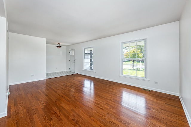 spare room with hardwood / wood-style flooring