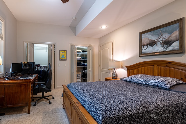 carpeted bedroom featuring a closet and a walk in closet