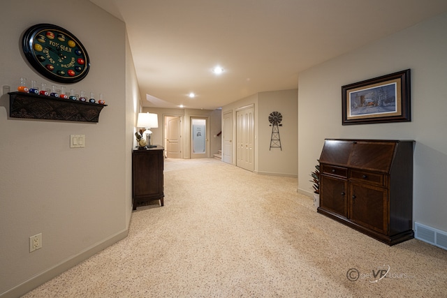 corridor featuring light carpet