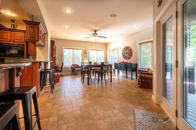 dining space featuring ceiling fan