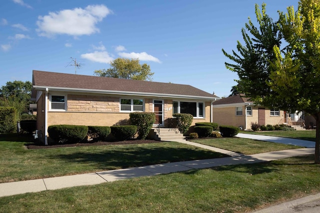 single story home featuring a front yard