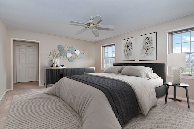 carpeted bedroom featuring ceiling fan