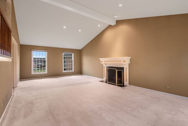 unfurnished living room with beamed ceiling, light colored carpet, and high vaulted ceiling