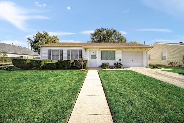 ranch-style house featuring a front lawn and a garage