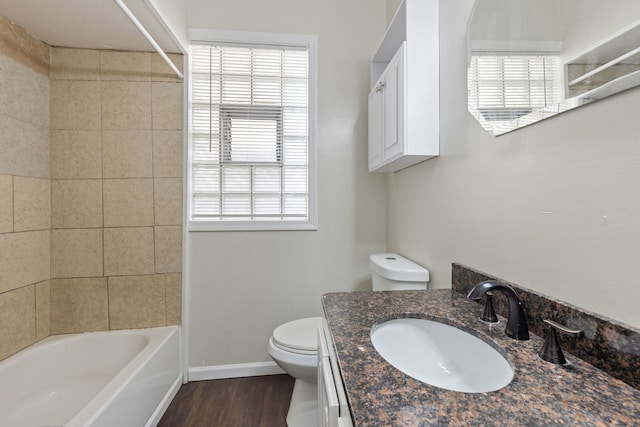 full bathroom with wood-type flooring, vanity, toilet, and a healthy amount of sunlight