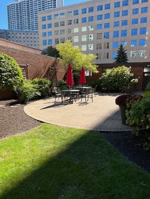 surrounding community featuring a yard and a patio area